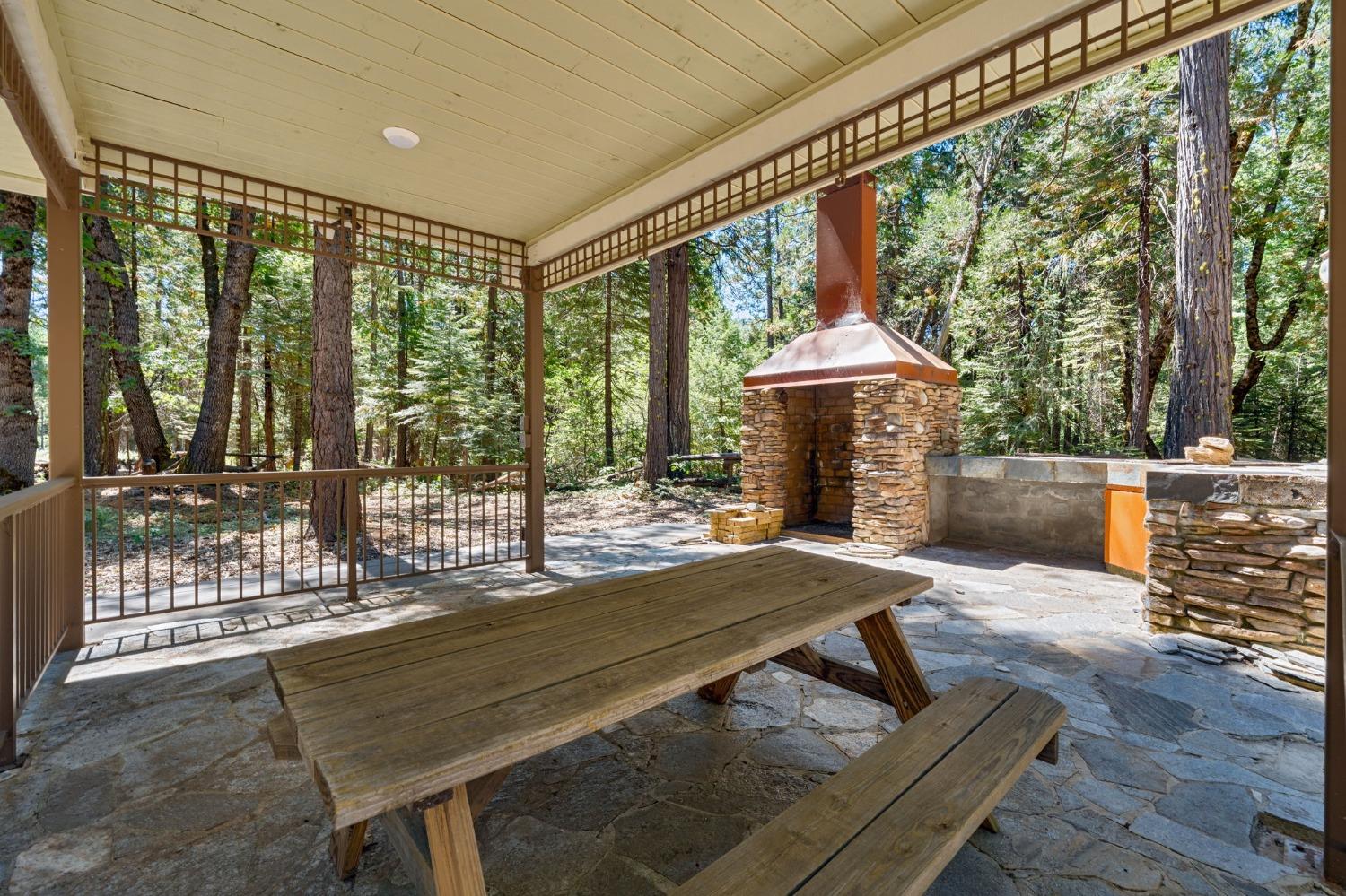 740 Hideaway Loop Alta, CA 95701 - Photo 37 of 74 a outdoor space with the couches and dining table with the garden view