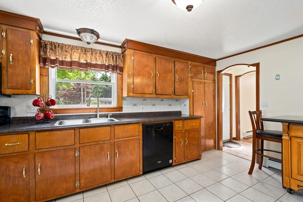 957 Ryan Road Northampton, MA 01062 - Photo 18 of 42 a kitchen with stainless steel appliances granite countertop a stove a sink and a microwave