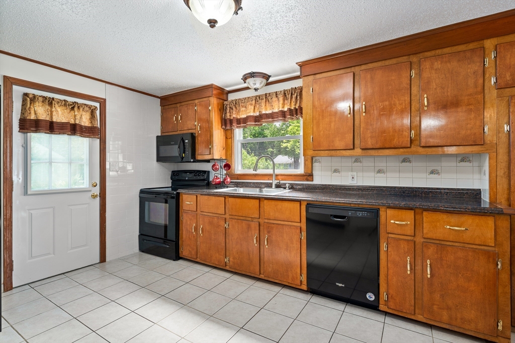 957 Ryan Road Northampton, MA 01062 - Photo 20 of 42 a kitchen with stainless steel appliances granite countertop a stove a sink and a refrigerator