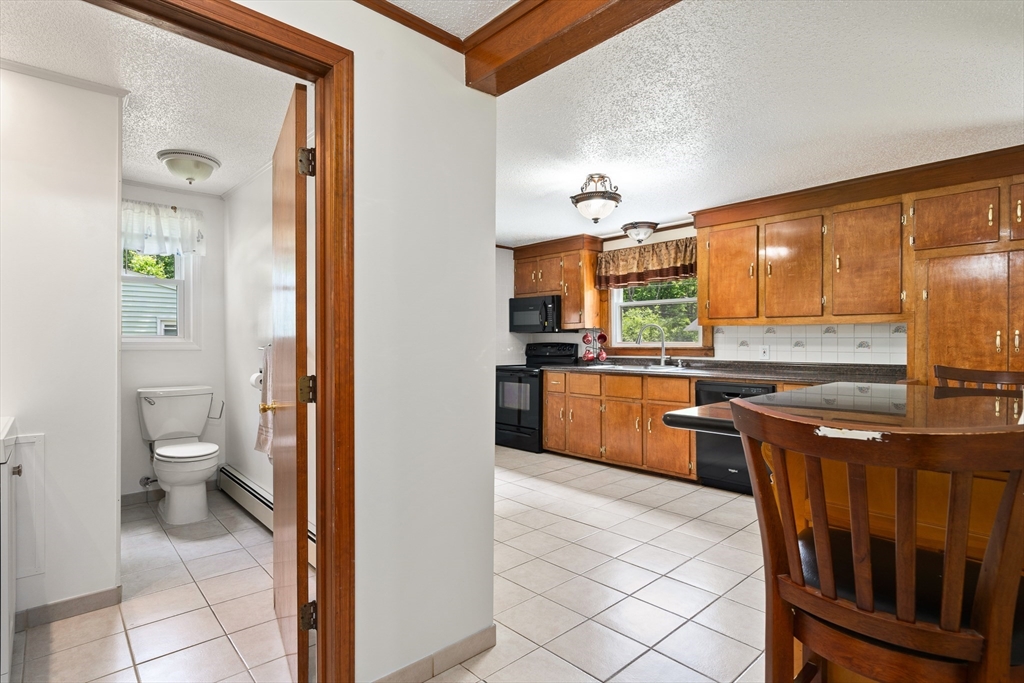 957 Ryan Road Northampton, MA 01062 - Photo 23 of 42 a kitchen with stainless steel appliances a sink and a refrigerator