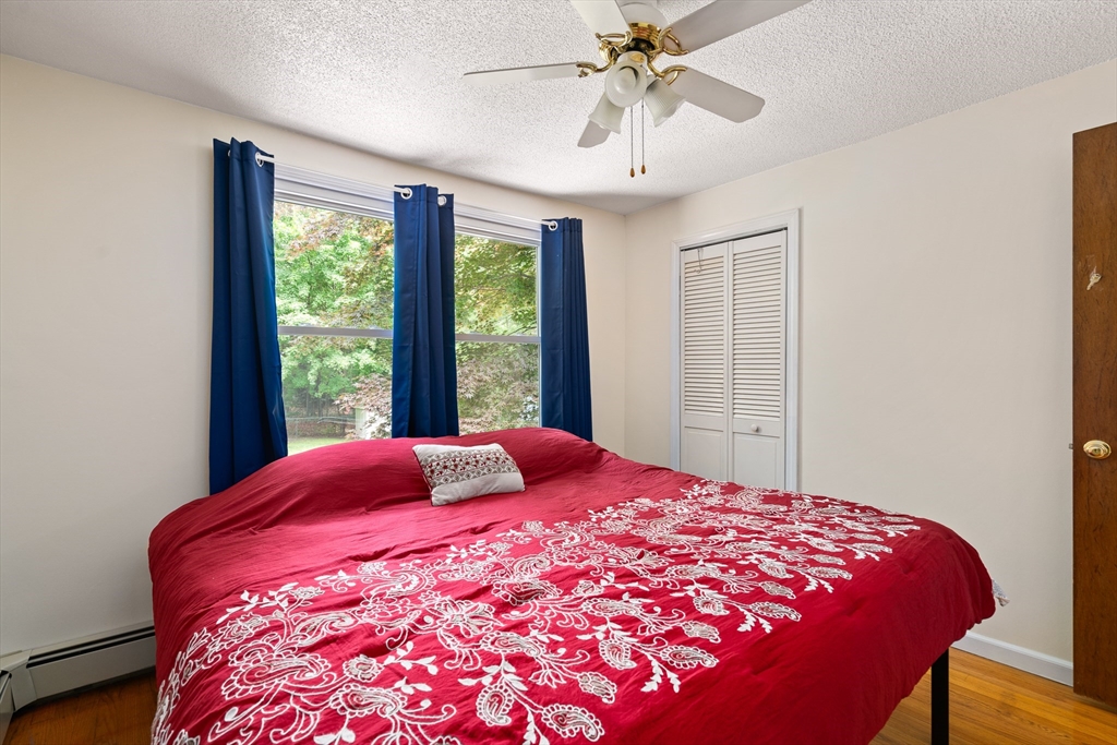 957 Ryan Road Northampton, MA 01062 - Photo 27 of 42 a bedroom with a large bed and a window