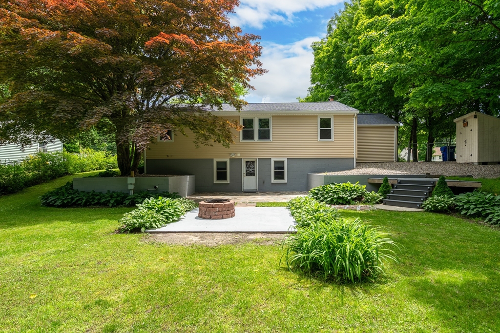 957 Ryan Road Northampton, MA 01062 - Photo 5 of 42 a front view of a house with a yard