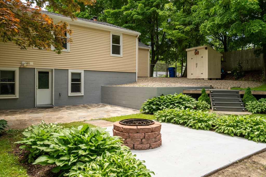957 Ryan Road Northampton, MA 01062 - Photo 8 of 42 a front view of a house with a garden