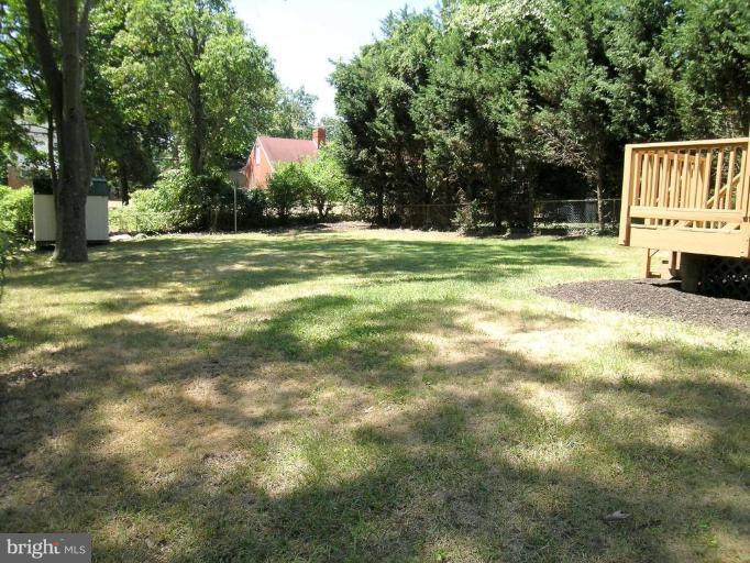 731 Overbrook Road Baltimore, MD 21212 - Photo 18 of 20 a view of a house with a big yard and large trees