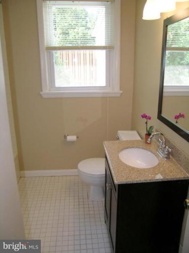 731 Overbrook Road Baltimore, MD 21212 - Photo 10 of 20 a bathroom with a sink a toilet and a window