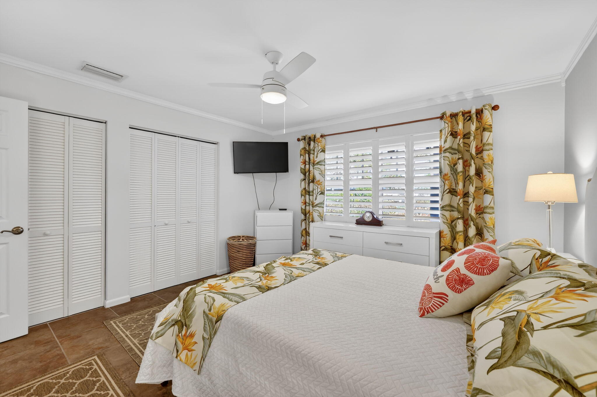 1252 East Madison Avenue Stuart, FL 34996 - Photo 11 of 43 a bedroom with a bed and a window