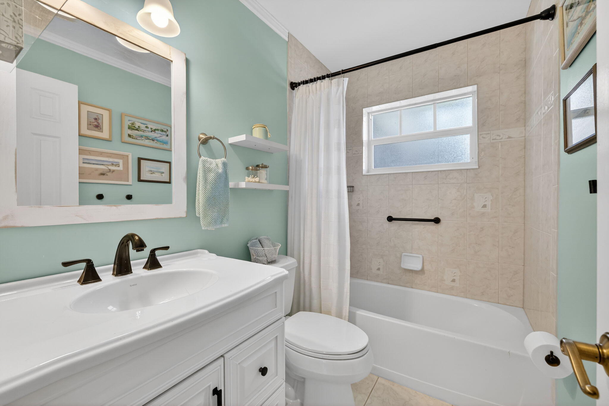 1252 East Madison Avenue Stuart, FL 34996 - Photo 20 of 43 a bathroom with a sink a toilet and shower