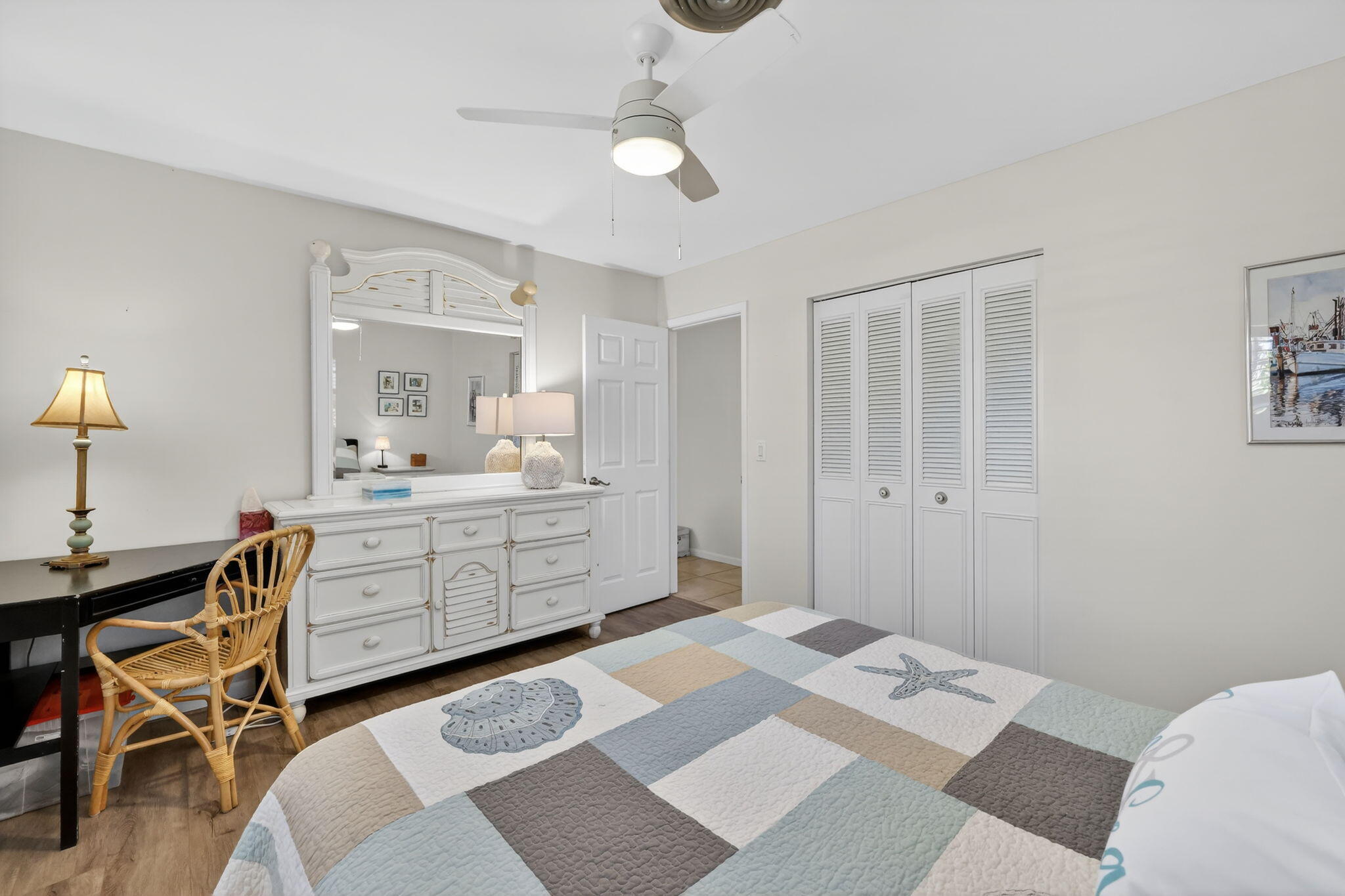 1252 East Madison Avenue Stuart, FL 34996 - Photo 21 of 43 a room with a bed a desk and chair