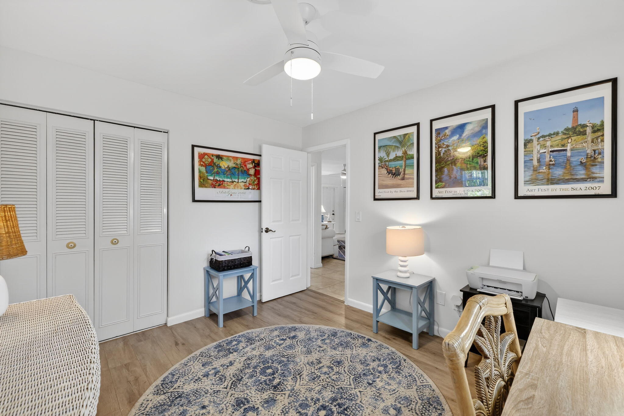 1252 East Madison Avenue Stuart, FL 34996 - Photo 23 of 43 a bedroom with a bed and a couch