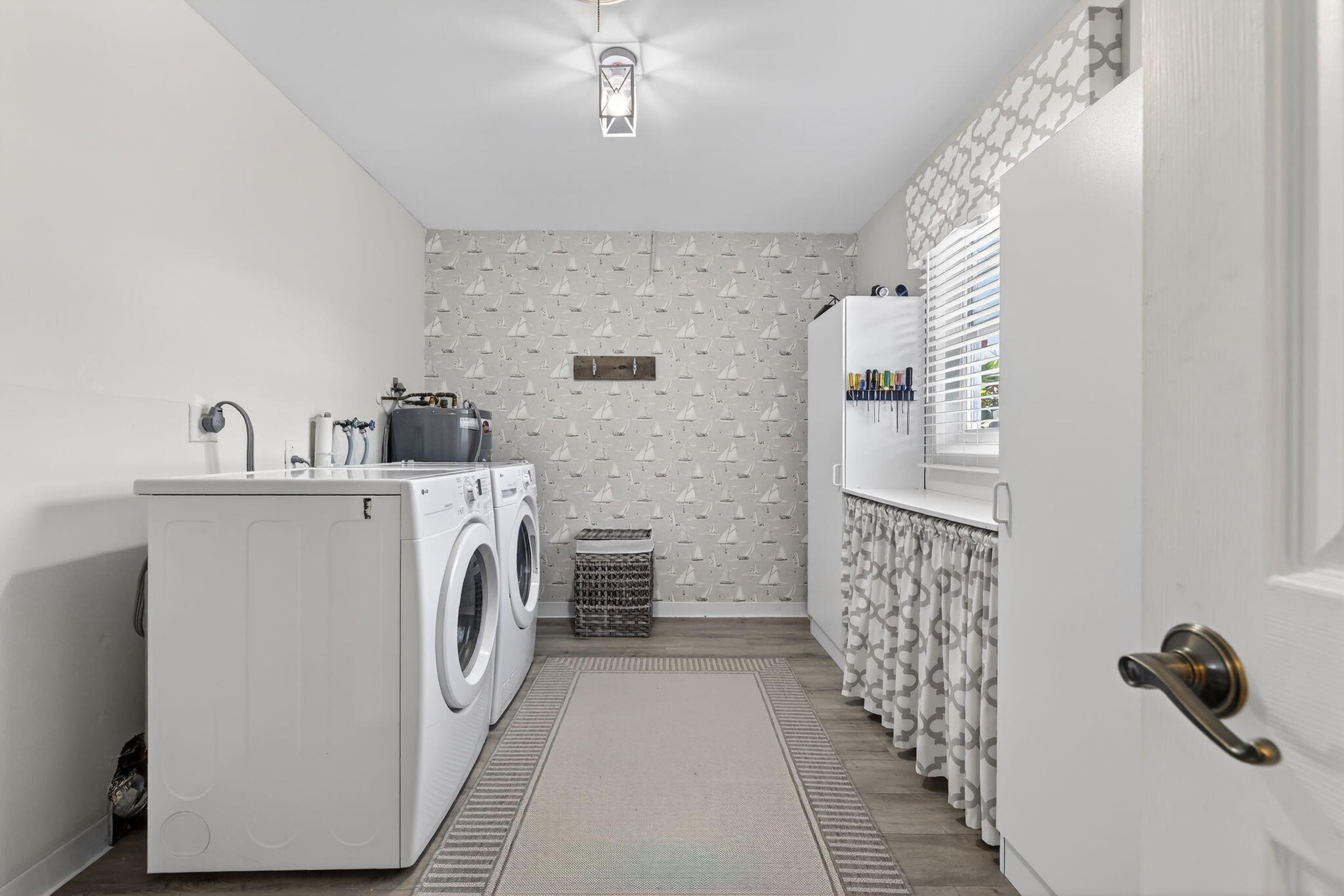 1252 East Madison Avenue Stuart, FL 34996 - Photo 24 of 43 a utility room with dryer and washer