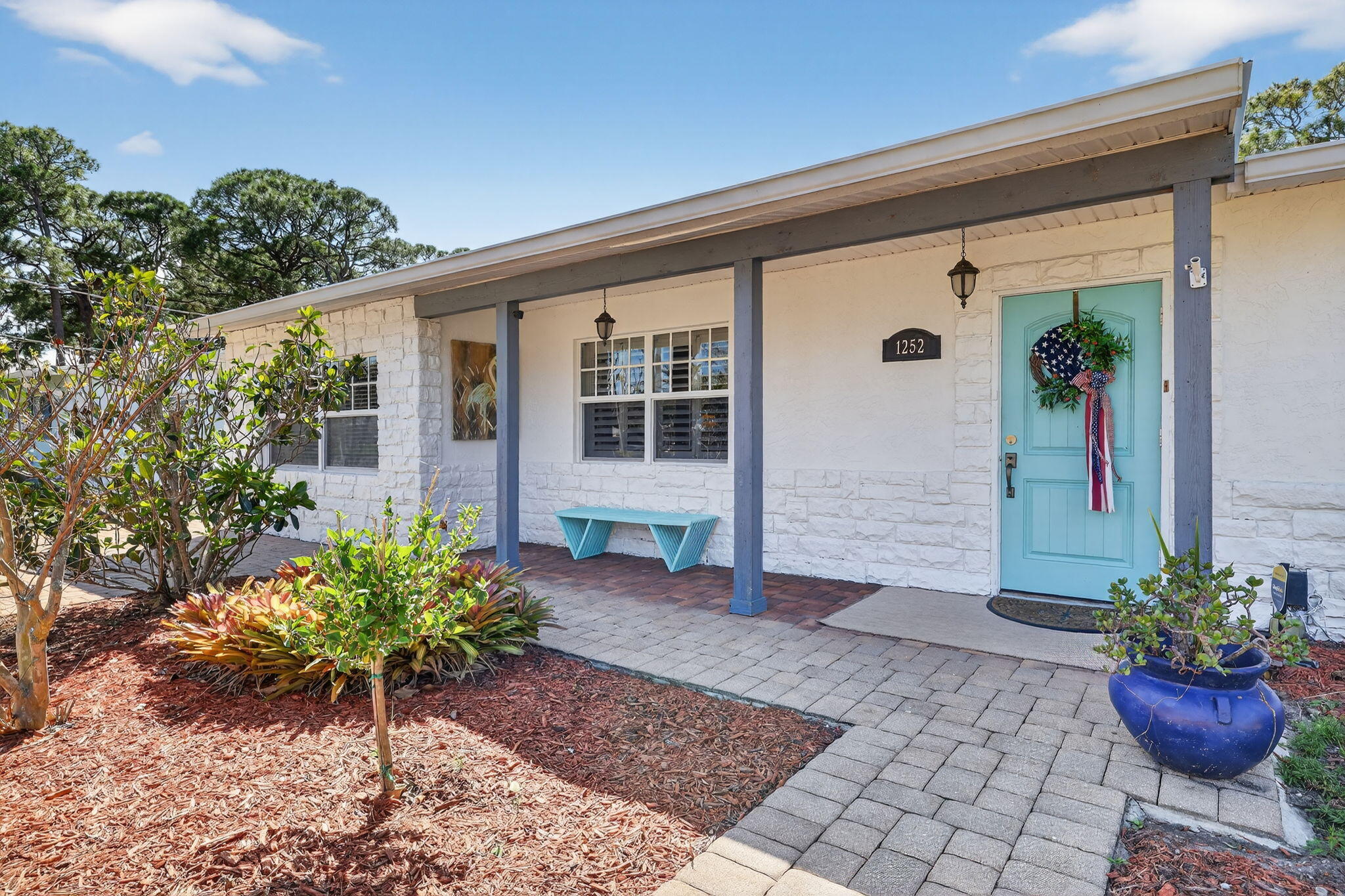 1252 East Madison Avenue Stuart, FL 34996 - Photo 3 of 43 a view of a entryway door front of house