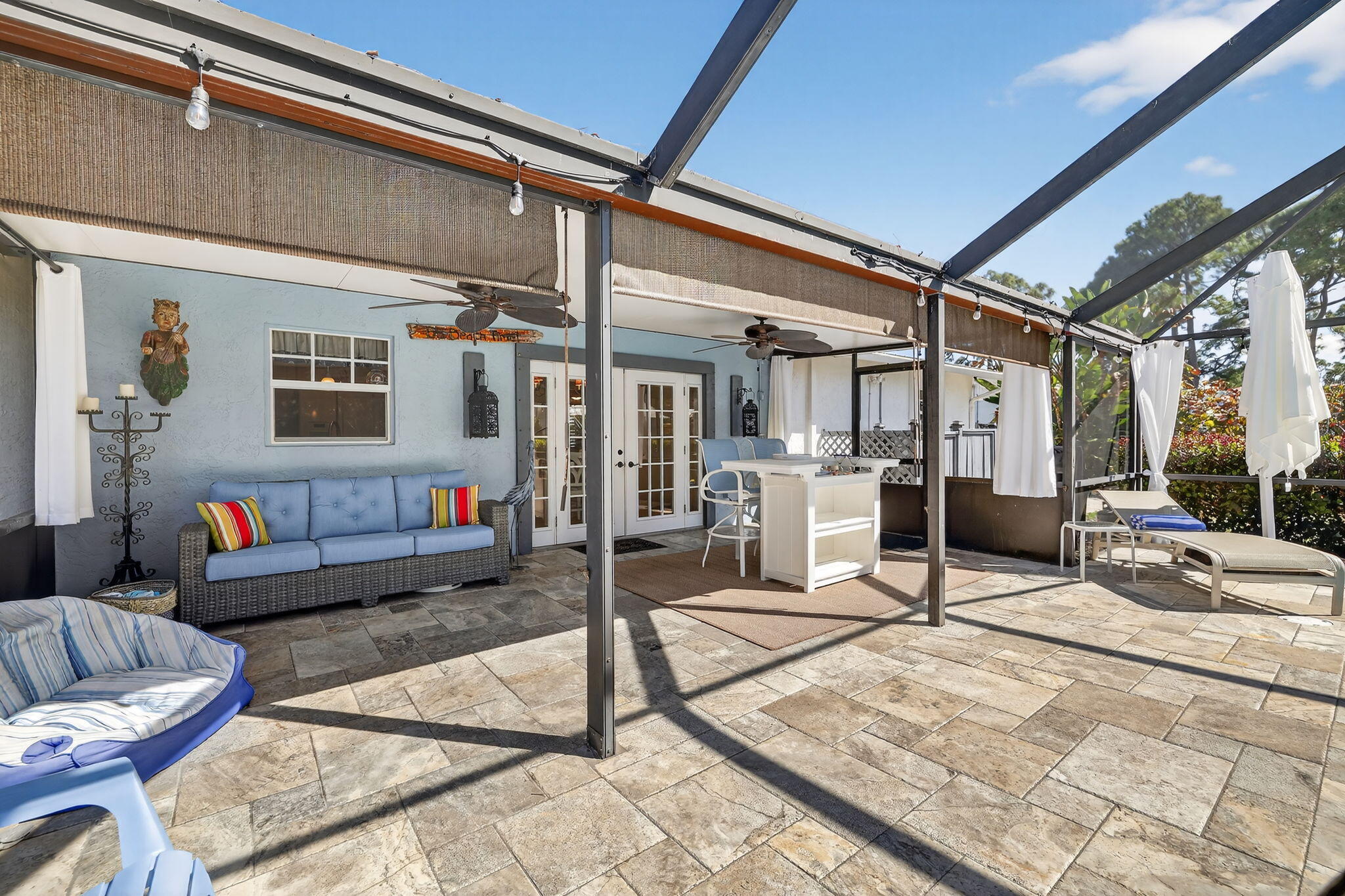 1252 East Madison Avenue Stuart, FL 34996 - Photo 31 of 43 a building outdoor space with patio furniture and potted plants