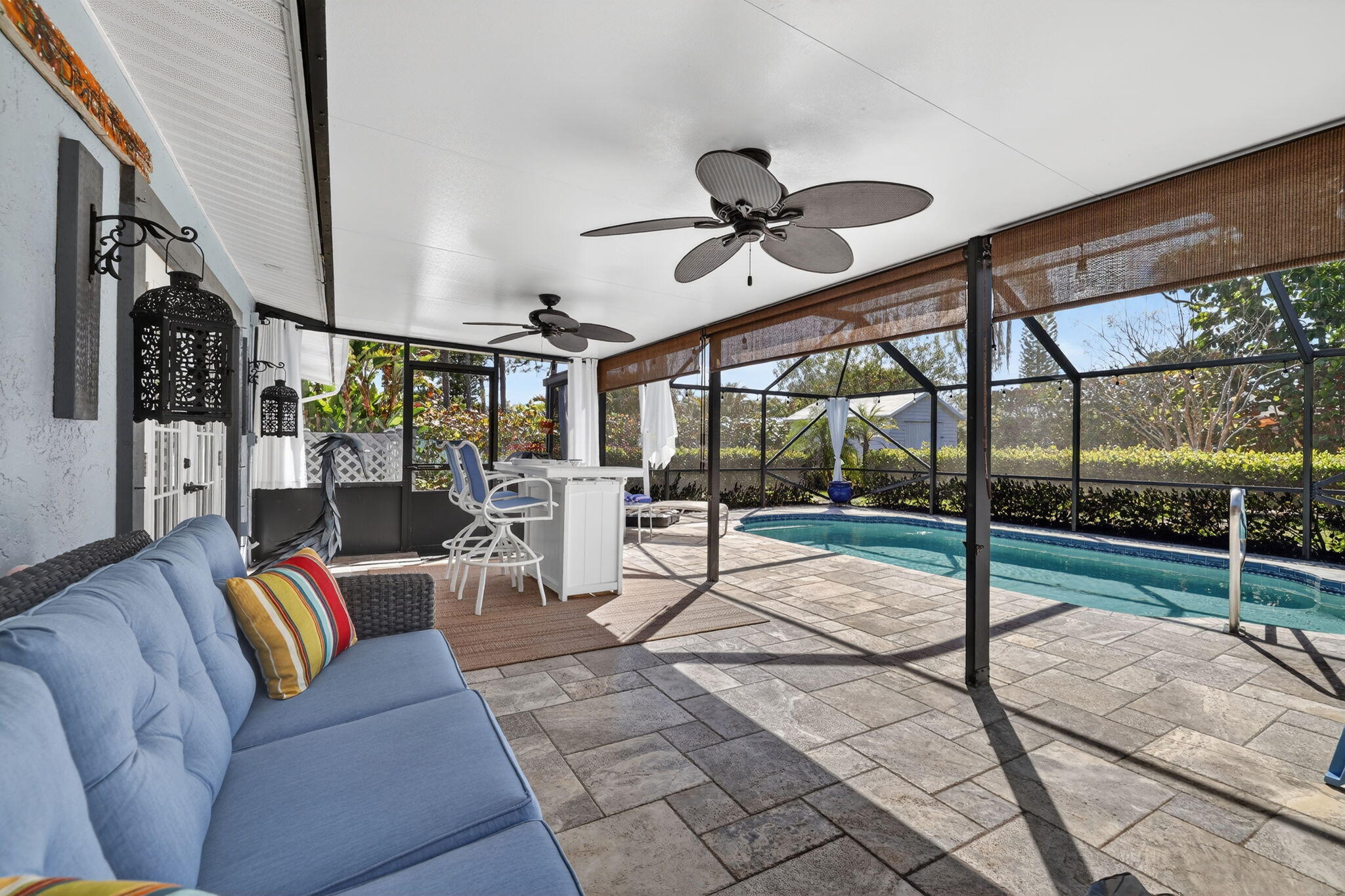 1252 East Madison Avenue Stuart, FL 34996 - Photo 32 of 43 a living room with a glass door