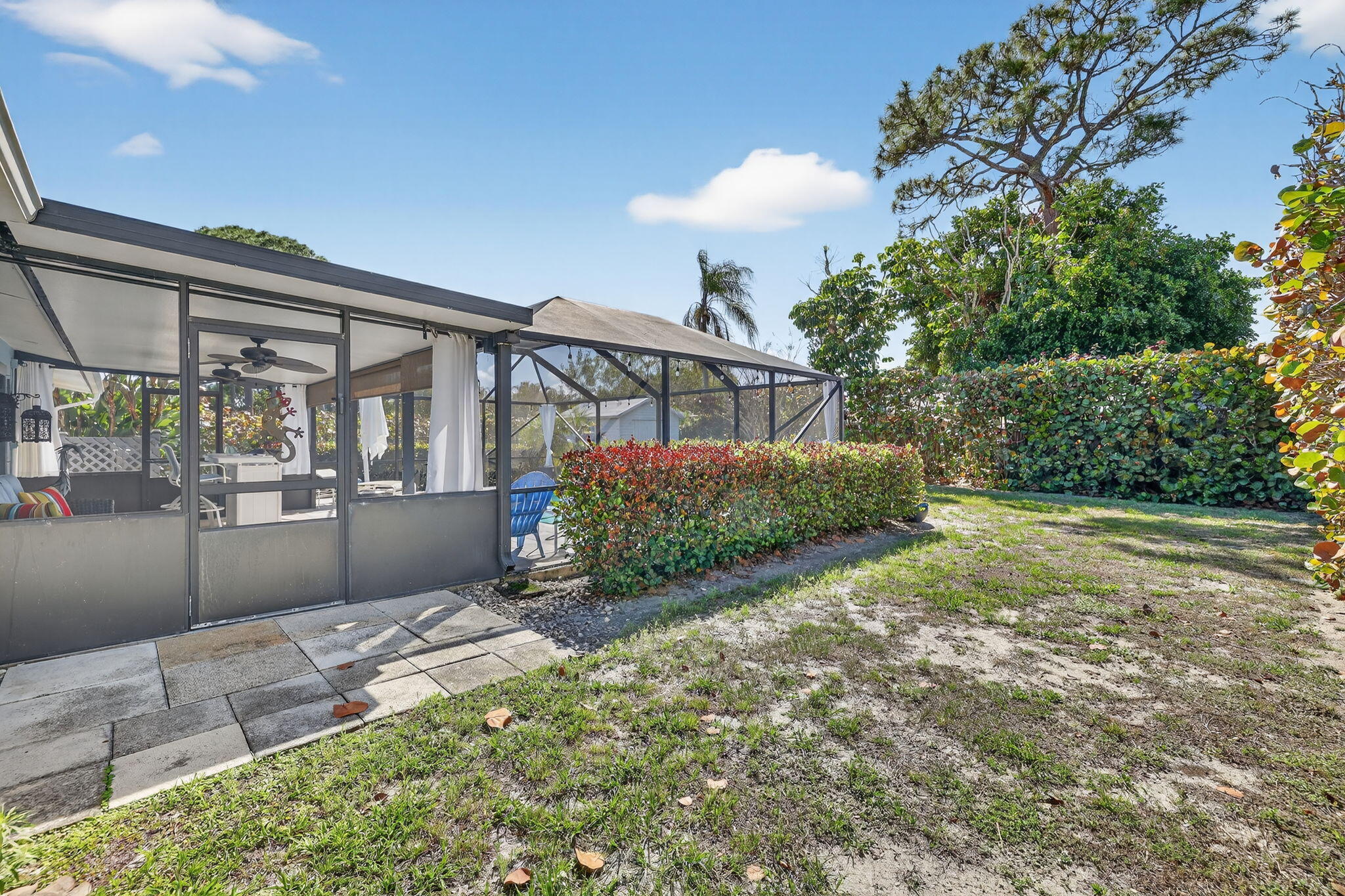 1252 East Madison Avenue Stuart, FL 34996 - Photo 34 of 43 a view of a house with a yard and potted plants
