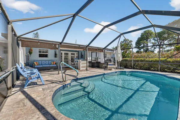 a view of swimming pool with outdoor seating