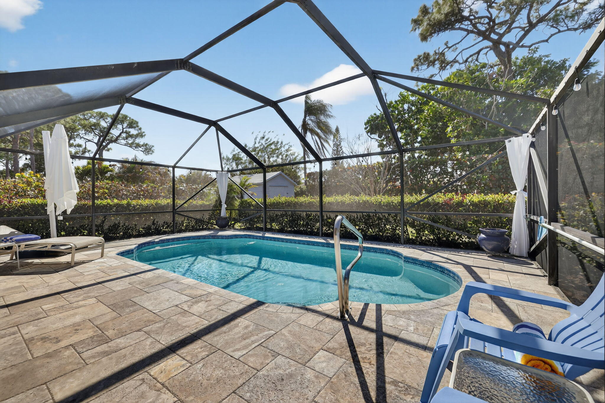 1252 East Madison Avenue Stuart, FL 34996 - Photo 37 of 43 a patio with a yard table and chairs