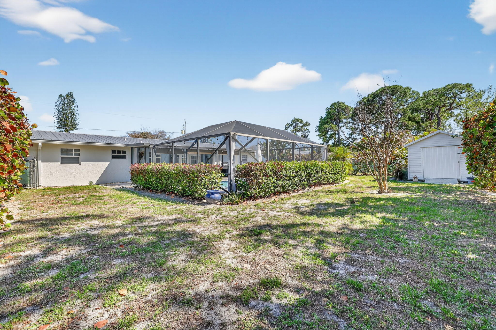 1252 East Madison Avenue Stuart, FL 34996 - Photo 39 of 43 a view of a house with a yard and garage