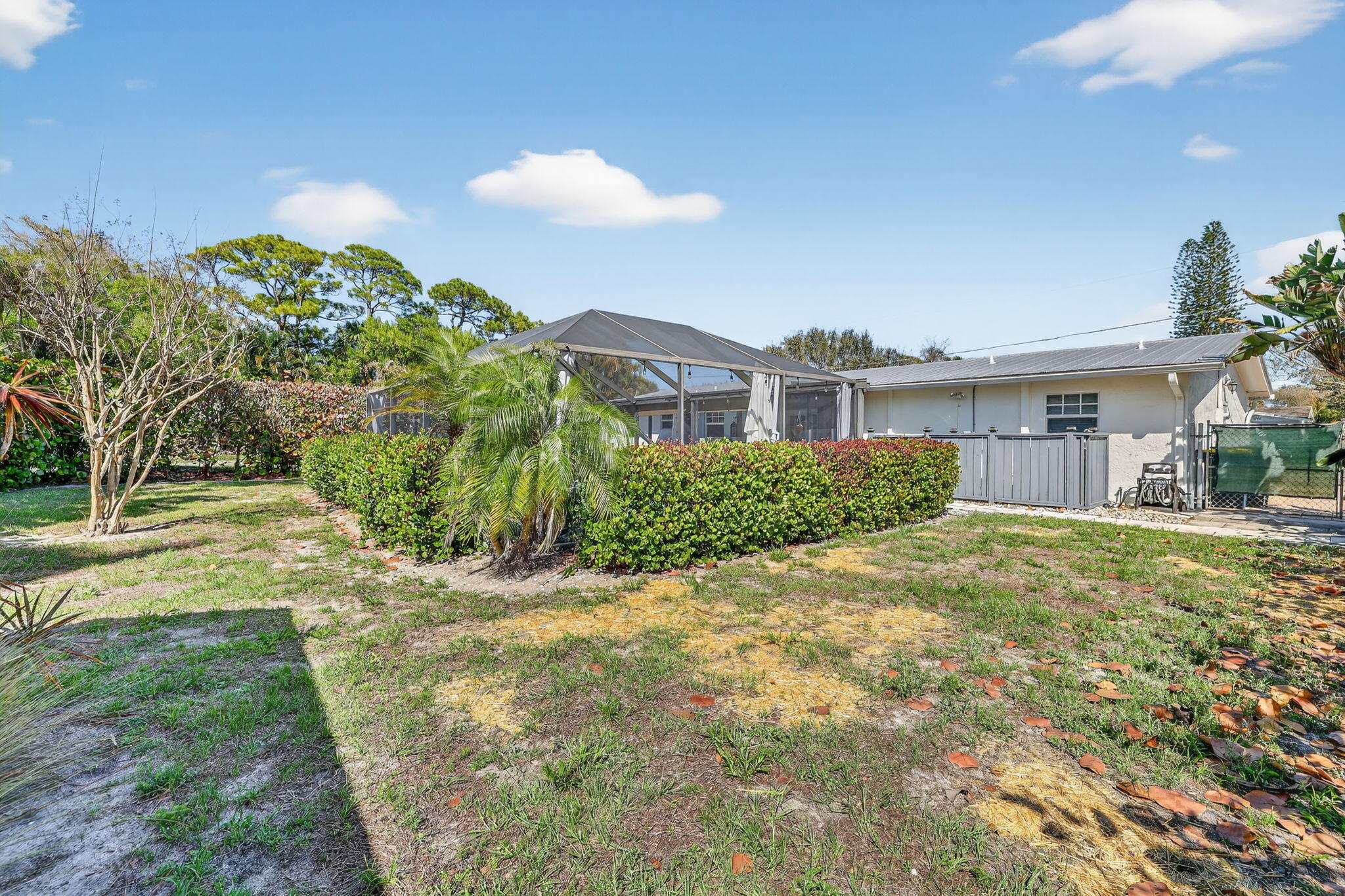 1252 East Madison Avenue Stuart, FL 34996 - Photo 40 of 43 a view of a house with a yard