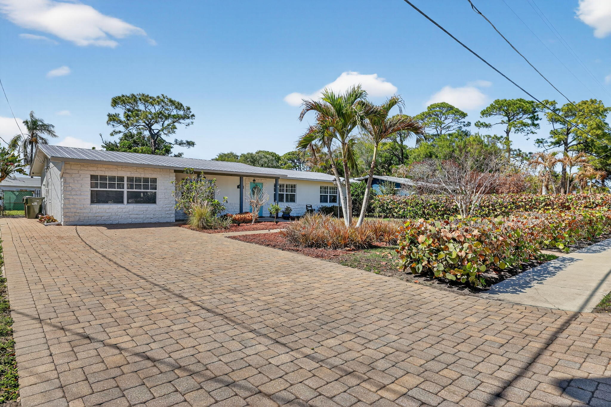 1252 East Madison Avenue Stuart, FL 34996 - Photo 42 of 43 a house with lots of trees in the background