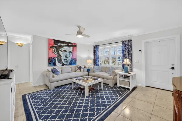 a living room with furniture and a rug