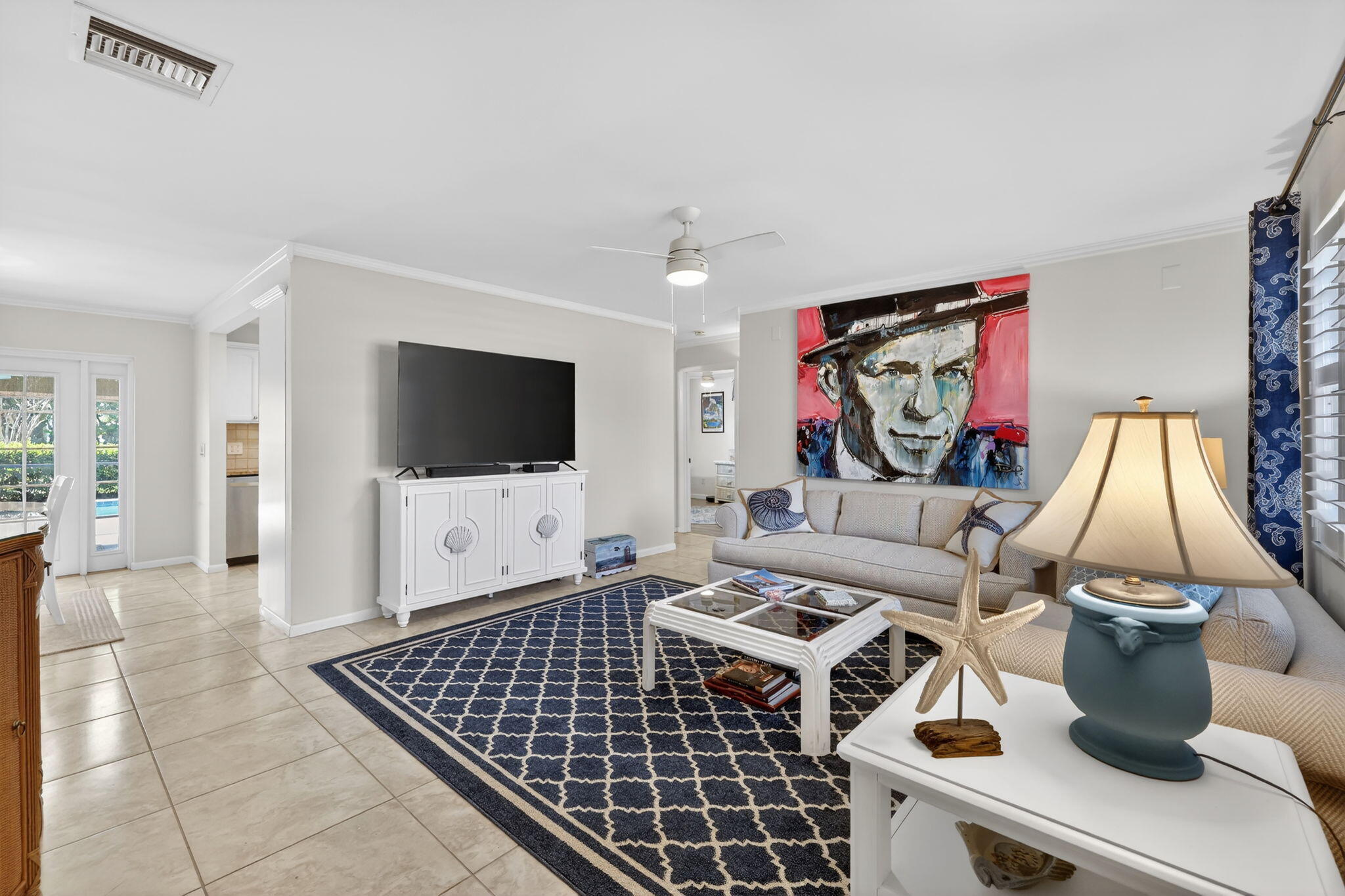 1252 East Madison Avenue Stuart, FL 34996 - Photo 6 of 43 a living room with furniture and a flat screen tv