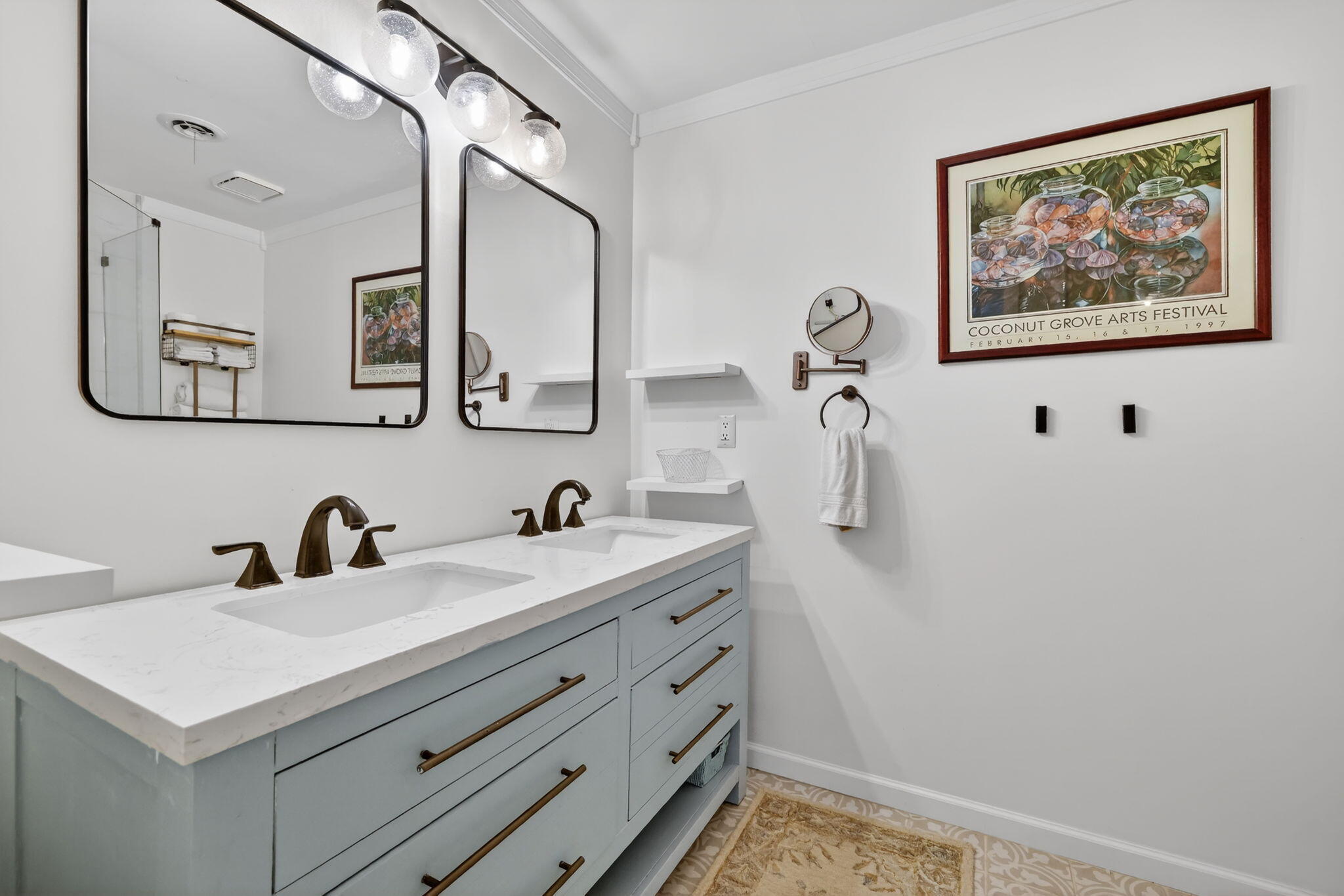 1252 East Madison Avenue Stuart, FL 34996 - Photo 9 of 43 a bathroom with a sink and a mirror