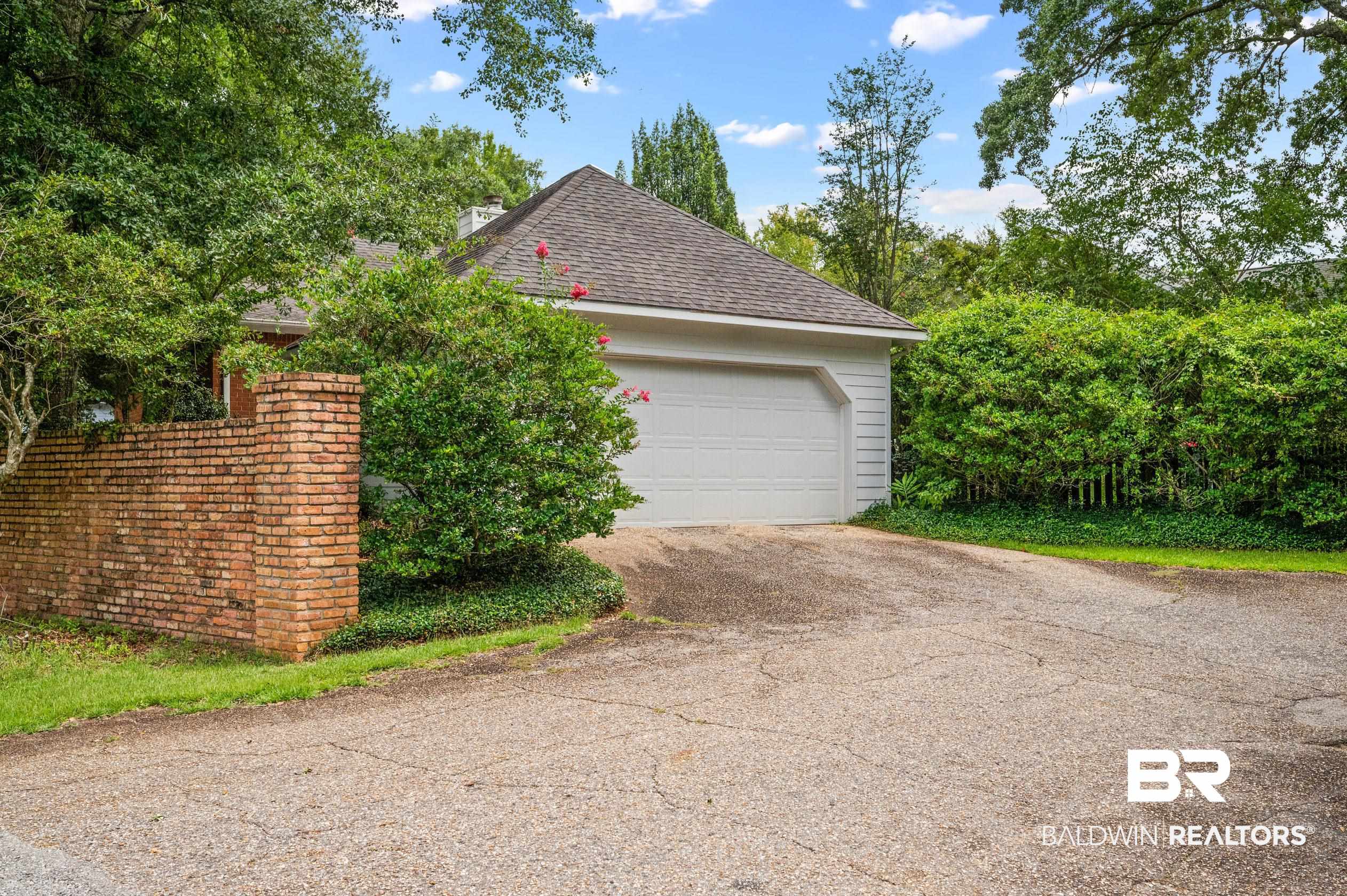 6638 Jackson Square Daphne, AL 36526 - Photo 61 of 62 Exterior space featuring a garage