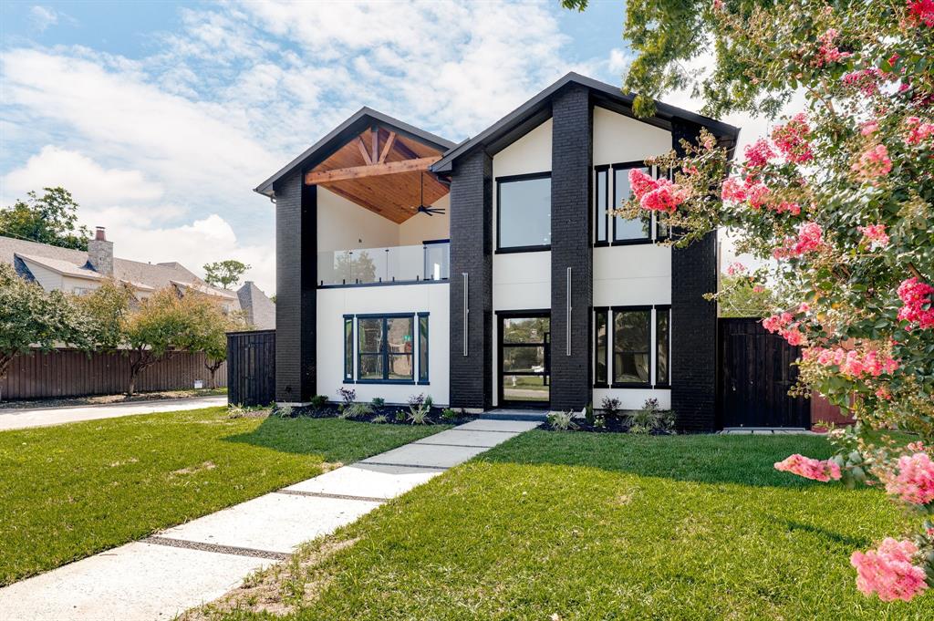 7503 Robin Road Dallas, TX 75209 - Photo 1 of 34 Modern home with ample balcony, brick siding, and stucco siding
