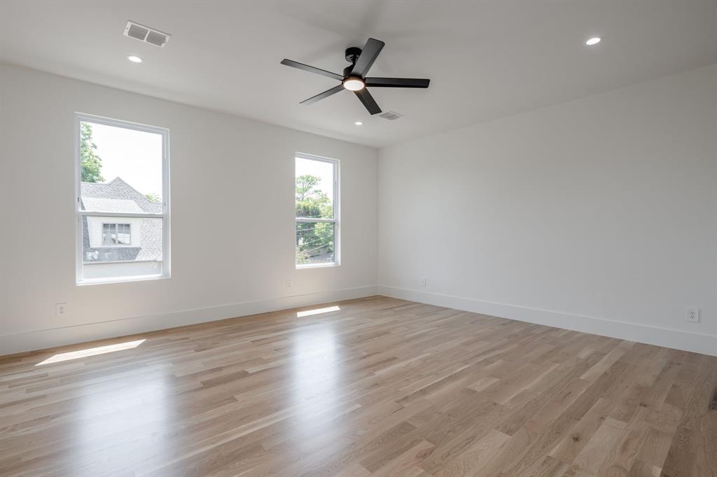 7503 Robin Road Dallas, TX 75209 - Photo 23 of 34 Empty room with light wood finished floors, recessed lighting, and a ceiling fan