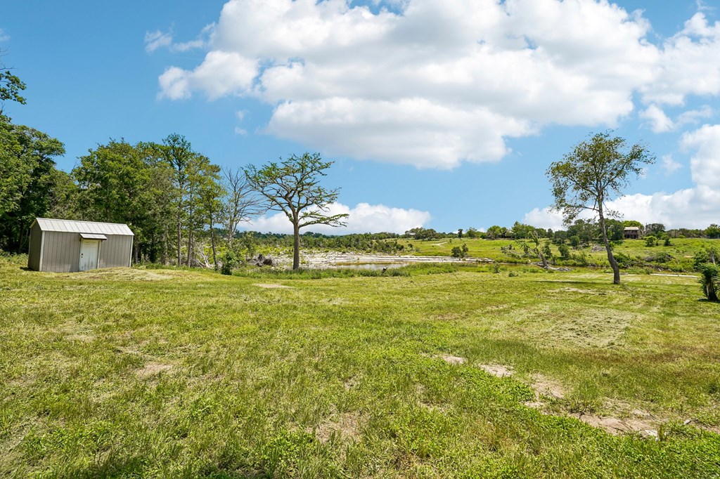 5953 Highway 27 Center Point, TX 78010 - Photo 4 of 21 a view of a big yard with table and chairs