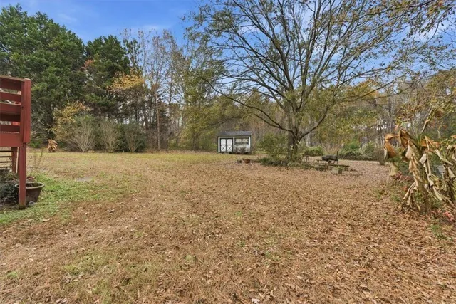 a view of open space with a house in the background