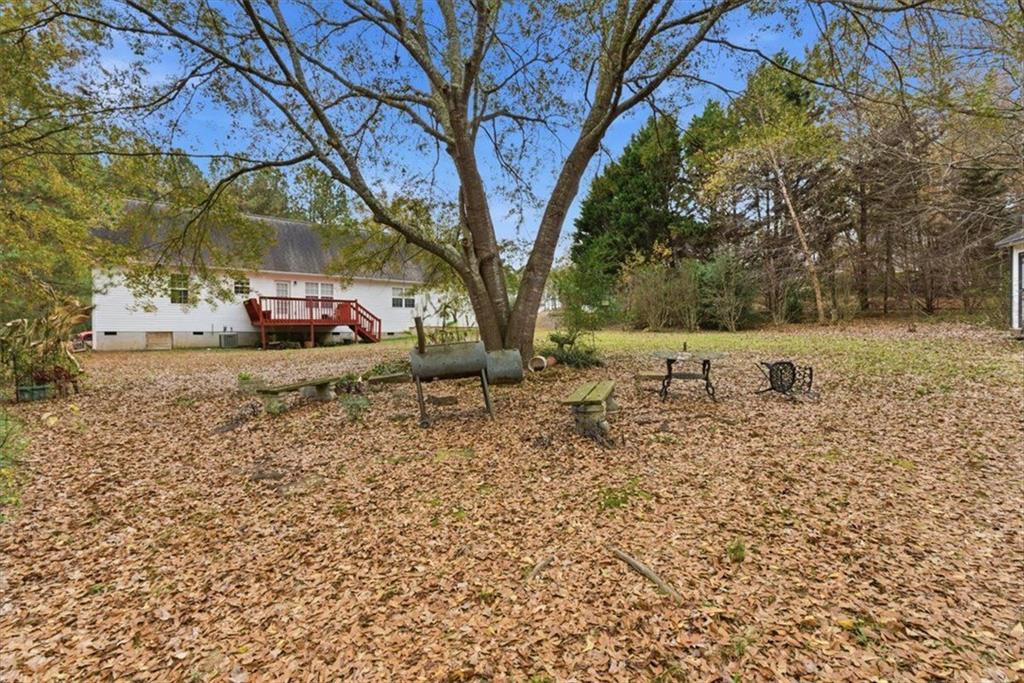 127 Prince Albert Court Southwest Calhoun, GA 30701 - Photo 39 of 50 a view of a yard with an tree