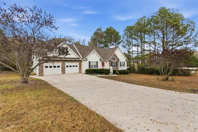 a front view of a house with a yard
