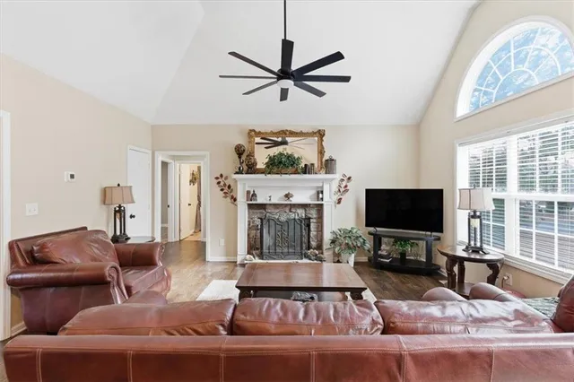 a living room with furniture and a flat screen tv