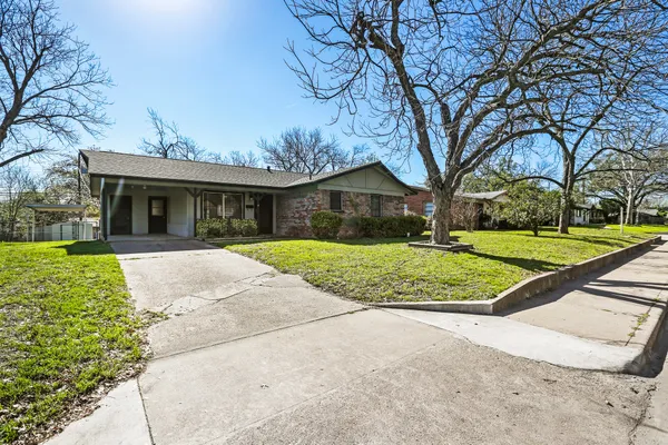 front view of a house with a yard