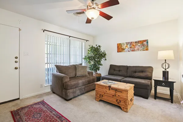 a living room with furniture and a window