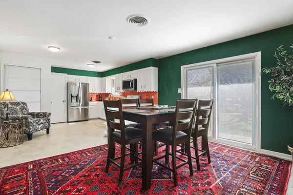 a view of a dining room with furniture