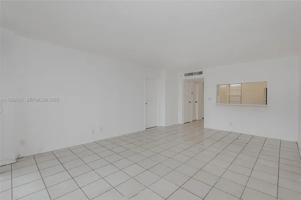 a view of an empty room and window