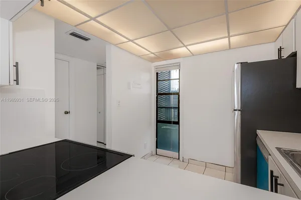 a view of storage and utility room with closet