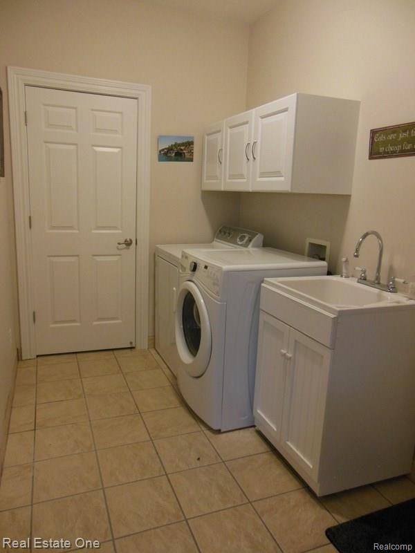 3225 Outback Trail Pinckney, MI 48169 - Photo 31 of 76 FIRST FLOOR LAUNDRY WITH A SERVICE SINK