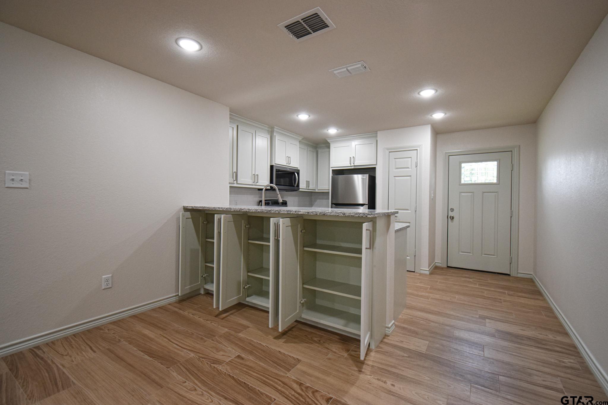 1417 East Earle Street Tyler, TX 75702 - Photo 16 of 31 a view of kitchen with wooden floor