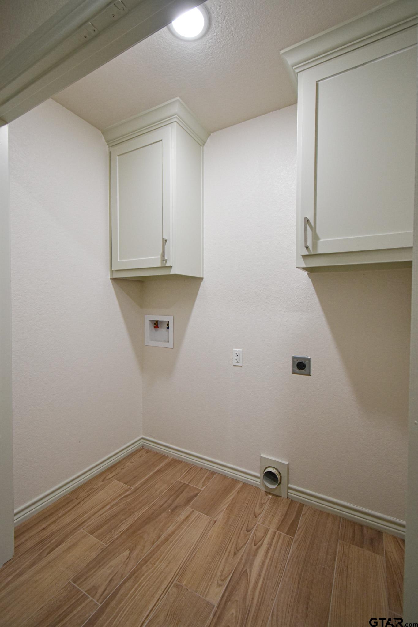 1417 East Earle Street Tyler, TX 75702 - Photo 17 of 31 a view of room with walk in closet and wooden floor