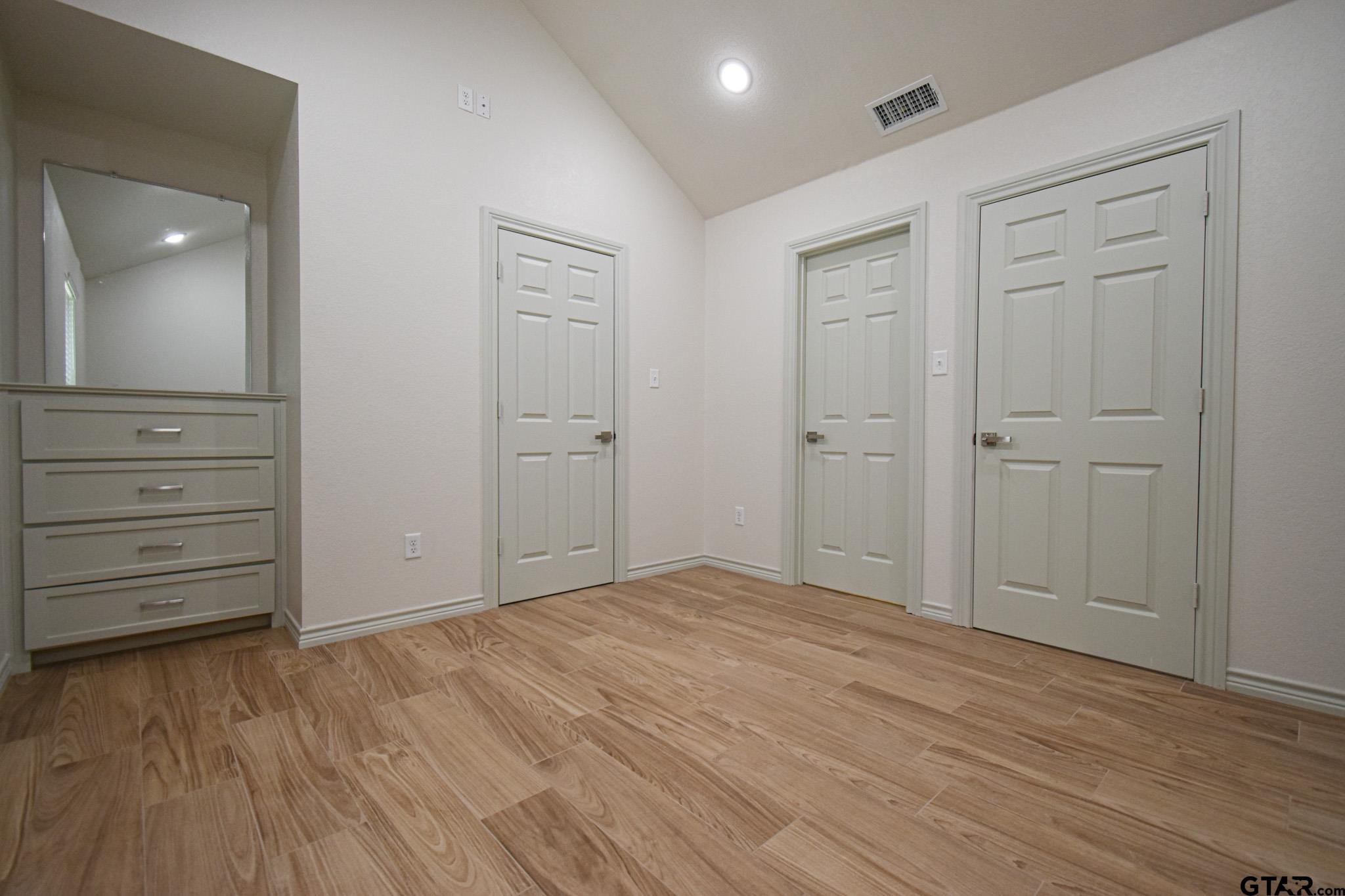 1417 East Earle Street Tyler, TX 75702 - Photo 20 of 31 wooden floor in an empty room