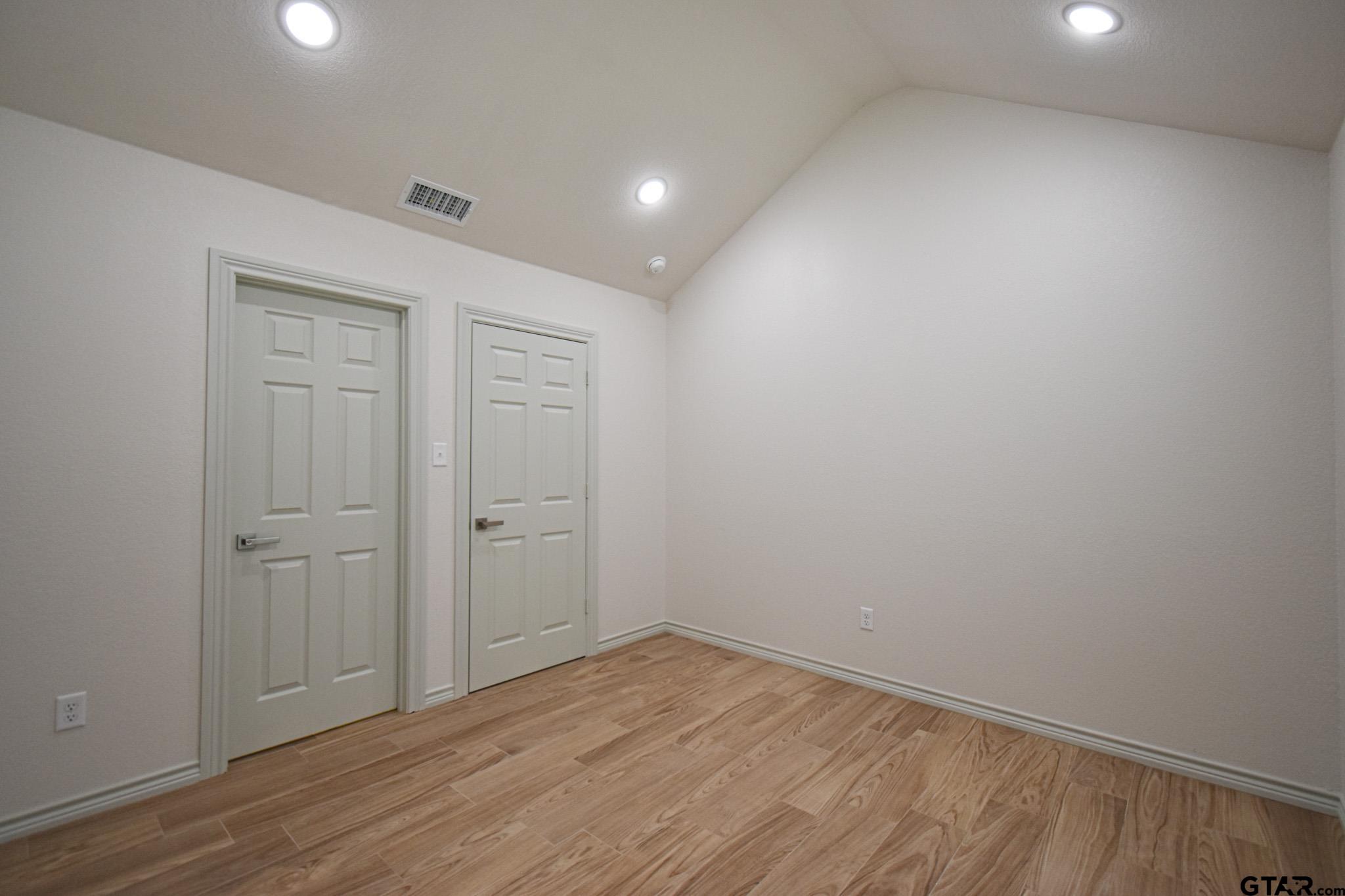 1417 East Earle Street Tyler, TX 75702 - Photo 21 of 31 wooden floor in an empty room