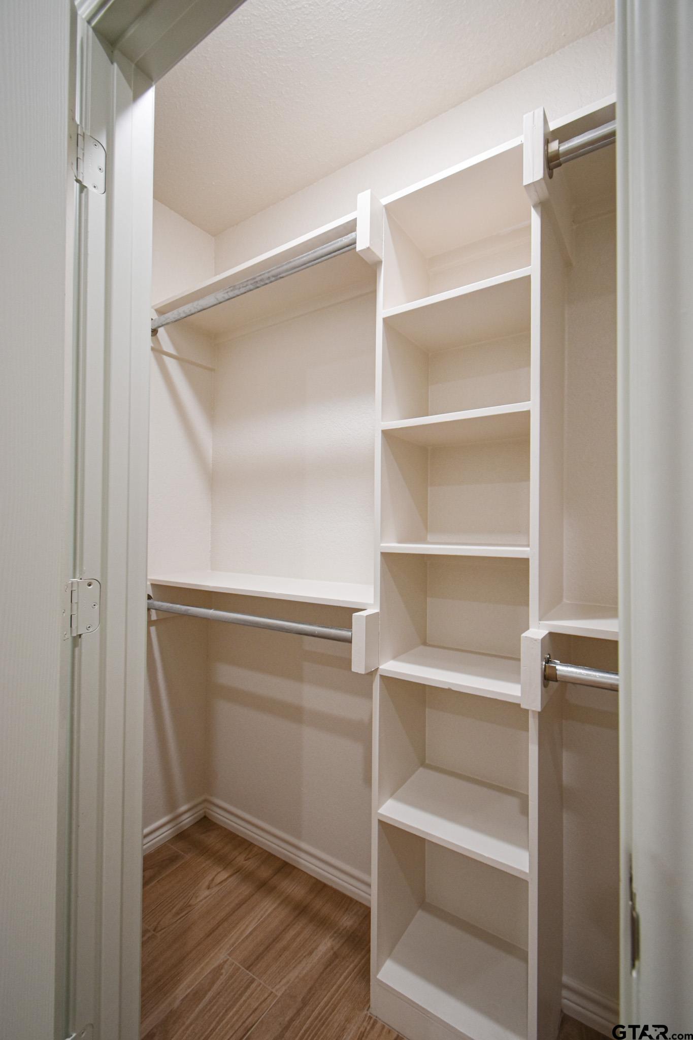 1417 East Earle Street Tyler, TX 75702 - Photo 22 of 31 a view of walk in closet with empty racks