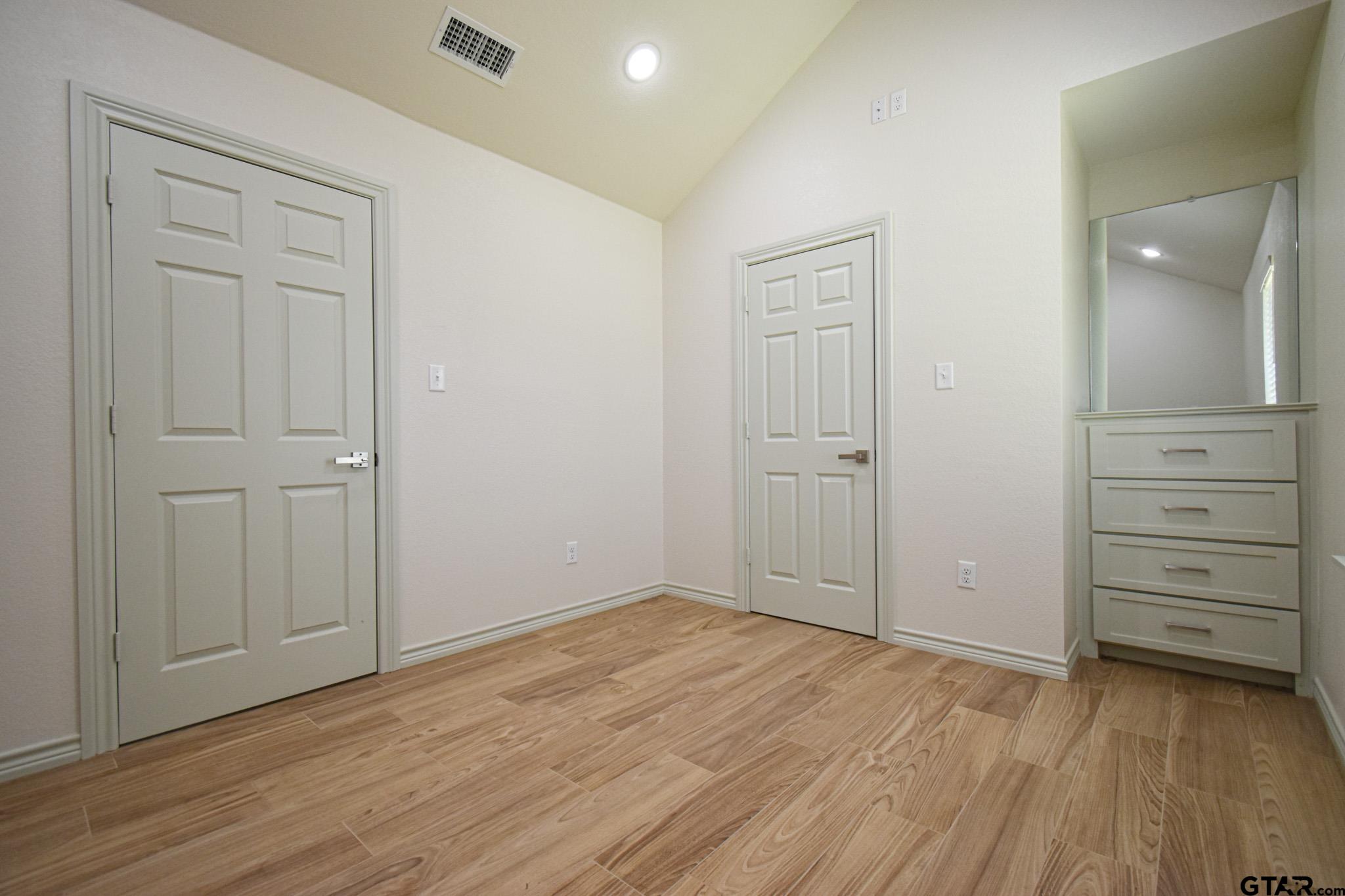 1417 East Earle Street Tyler, TX 75702 - Photo 25 of 31 wooden floor in an empty room