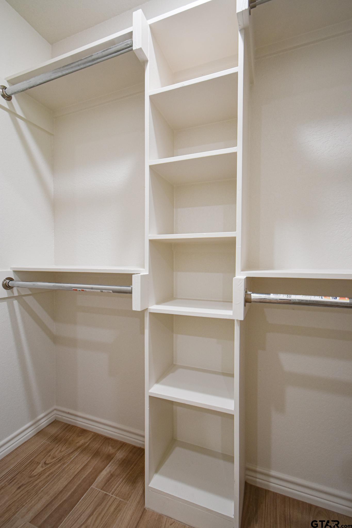 1417 East Earle Street Tyler, TX 75702 - Photo 27 of 31 a view of walk in closet with empty racks