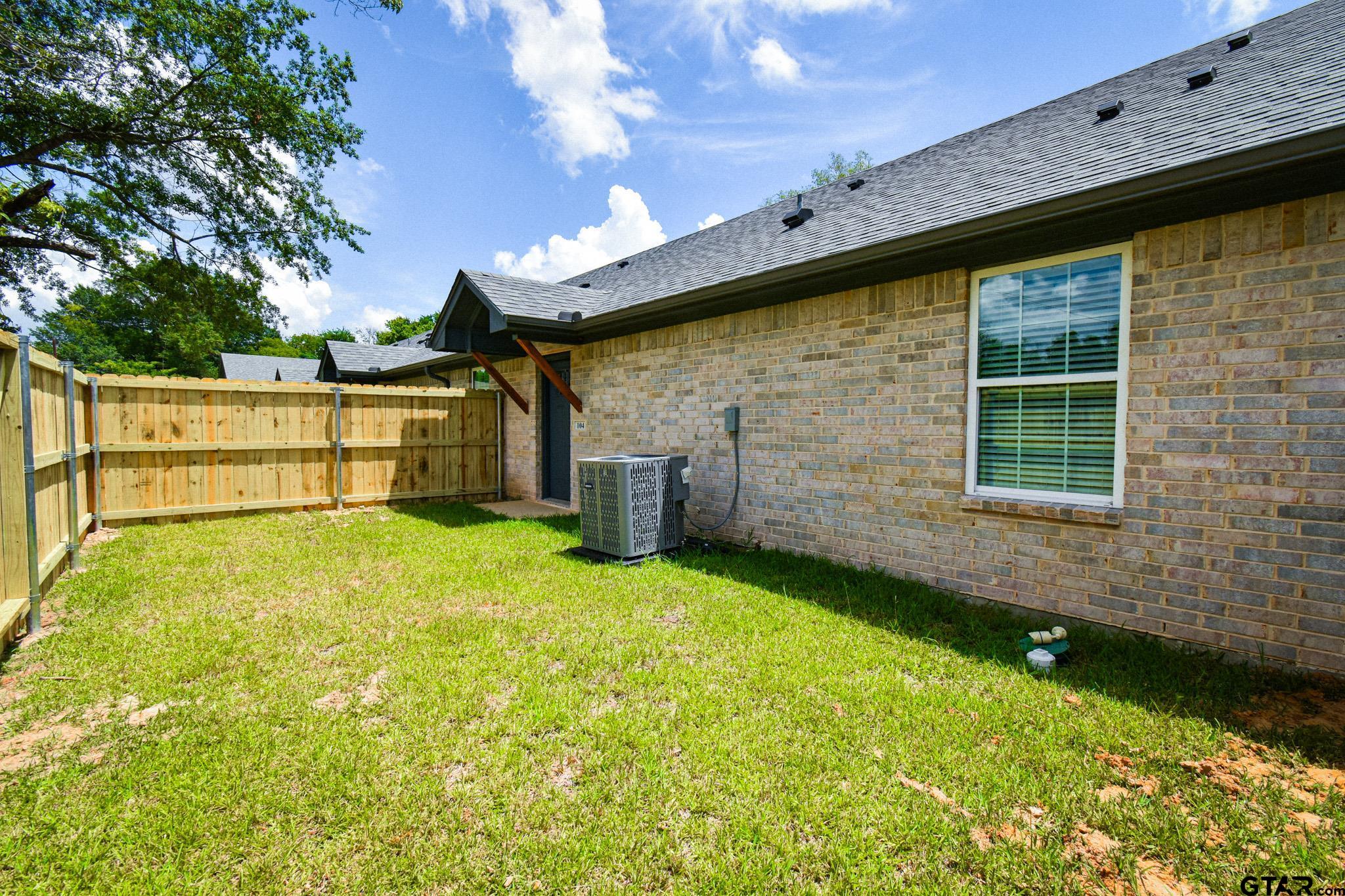 1417 East Earle Street Tyler, TX 75702 - Photo 31 of 31 a front view of a house with a yard