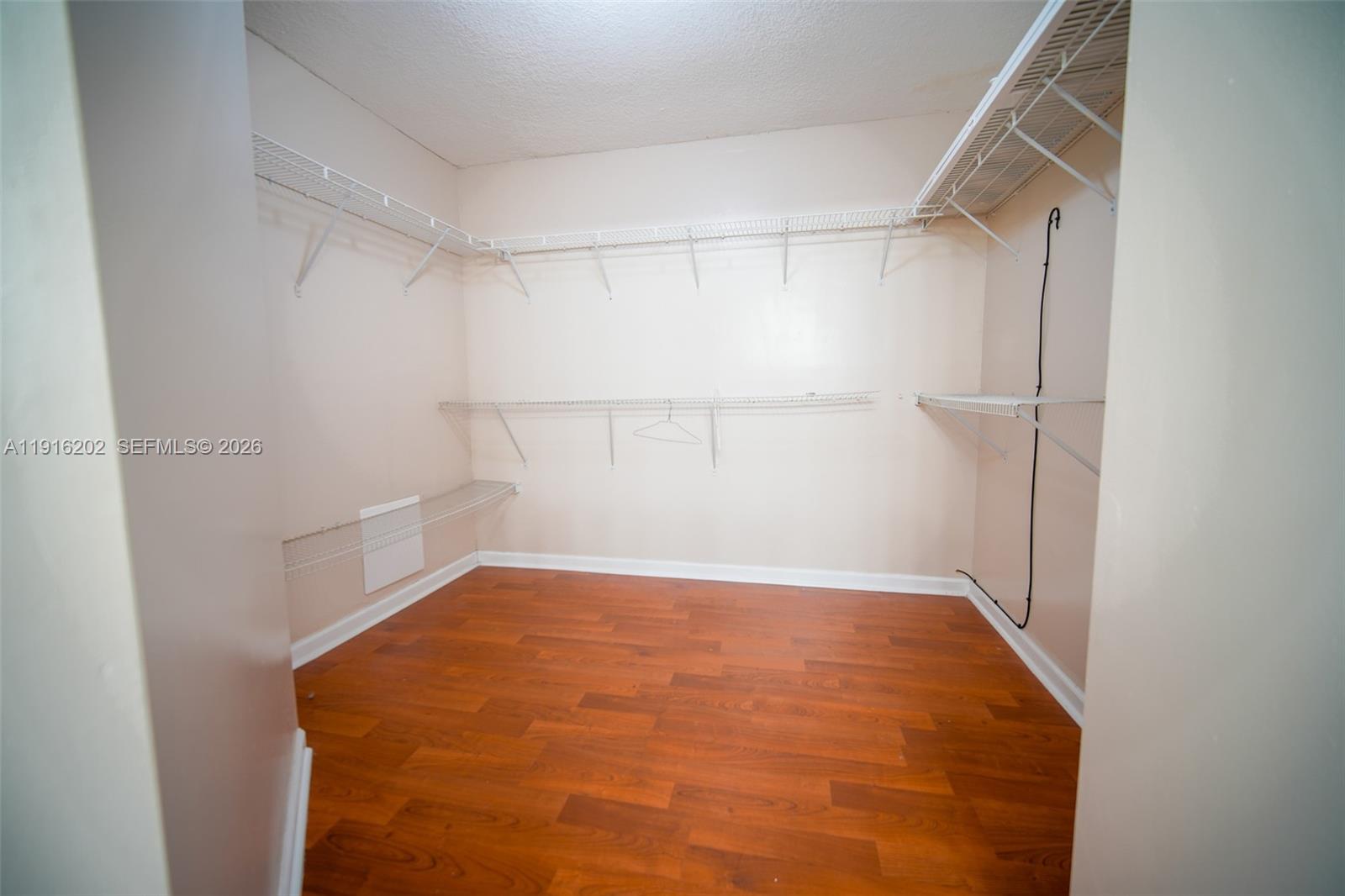 8568 Southwest 211th Terrace, Unit 8576 Cutler Bay, FL 33189 - Photo 13 of 26 a view of an empty room