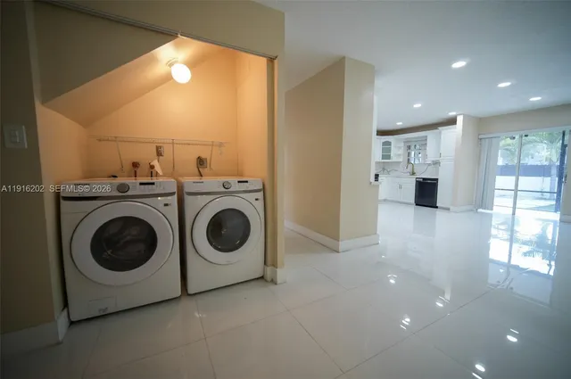 a utility room with dryer and washer